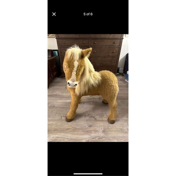The product is a large Hasbro butterscotch FurReal Friends interactive animate r